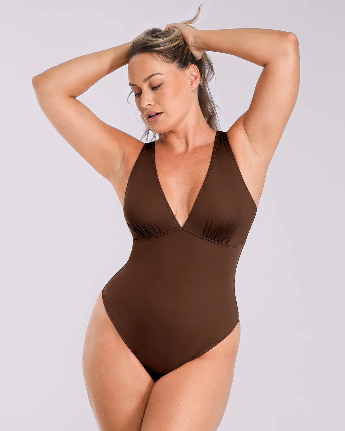 Bare Essentials™ AirSlim® Deep V-Neck Cross Back Thong Bodysuit